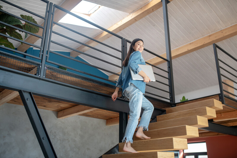 woman climbing staircase shared ownership